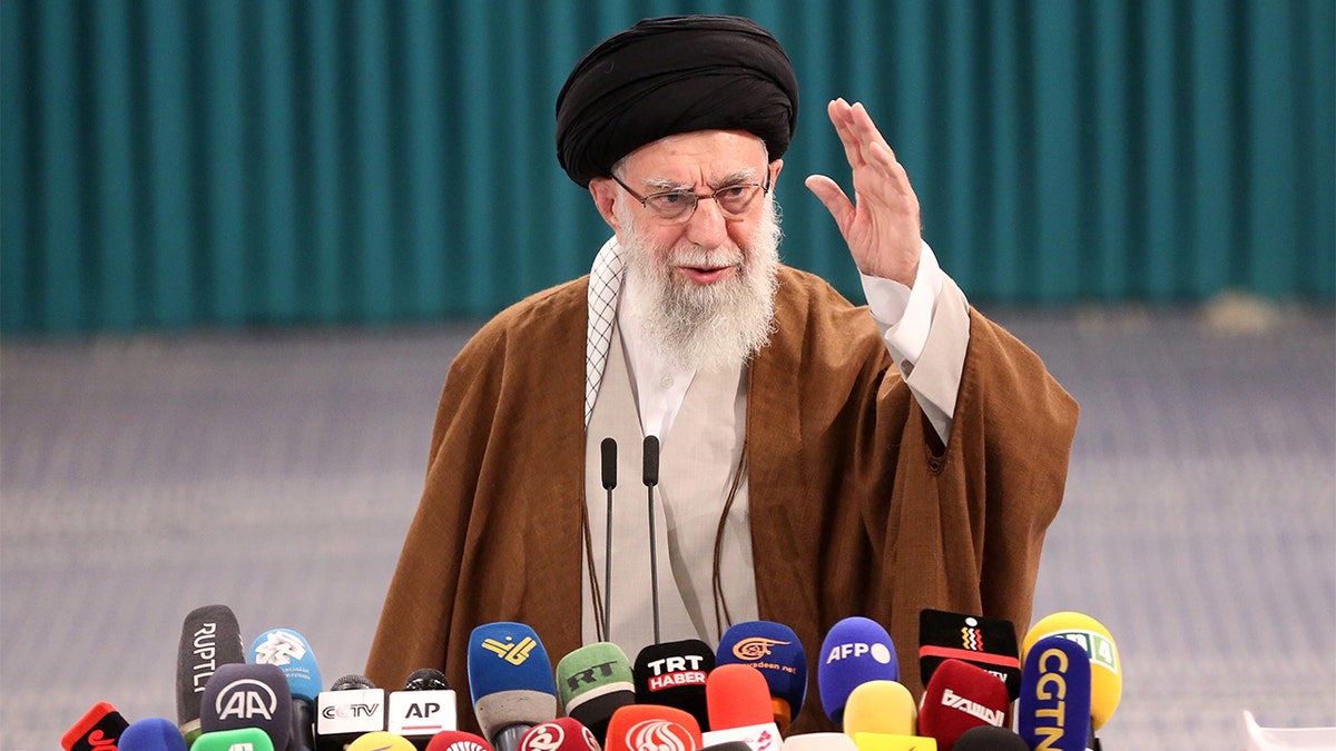 Ayatollah at lectern with microphones