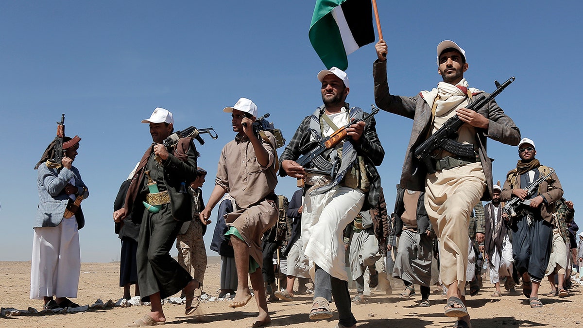 Houthi rebel fighters march during a rally of support for the Palestinians in the Gaza Strip and against the U.S. strikes on Yemen outside Sanaa on Jan. 22, 2024