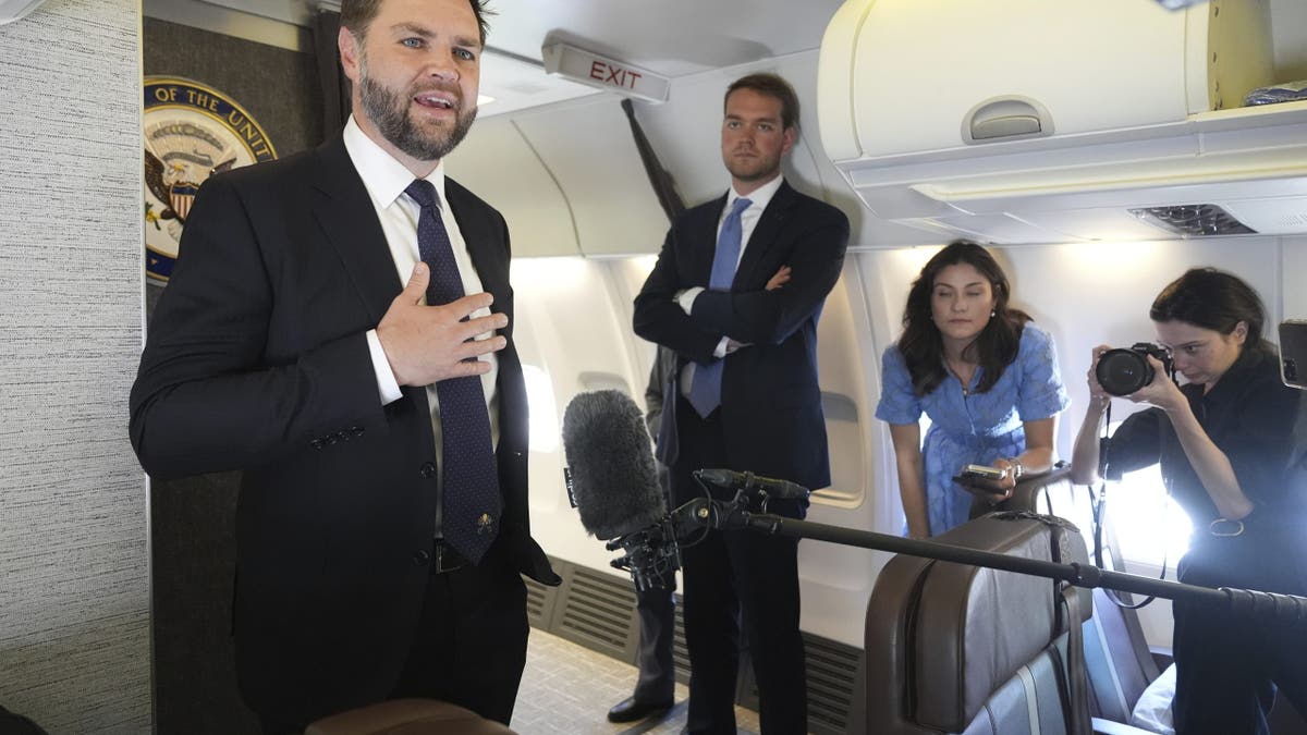 Vice President JD Vance talks to reporters inside Air Force Two at Leonardo da Vinci International Airport in Rome on May 19, 2025.