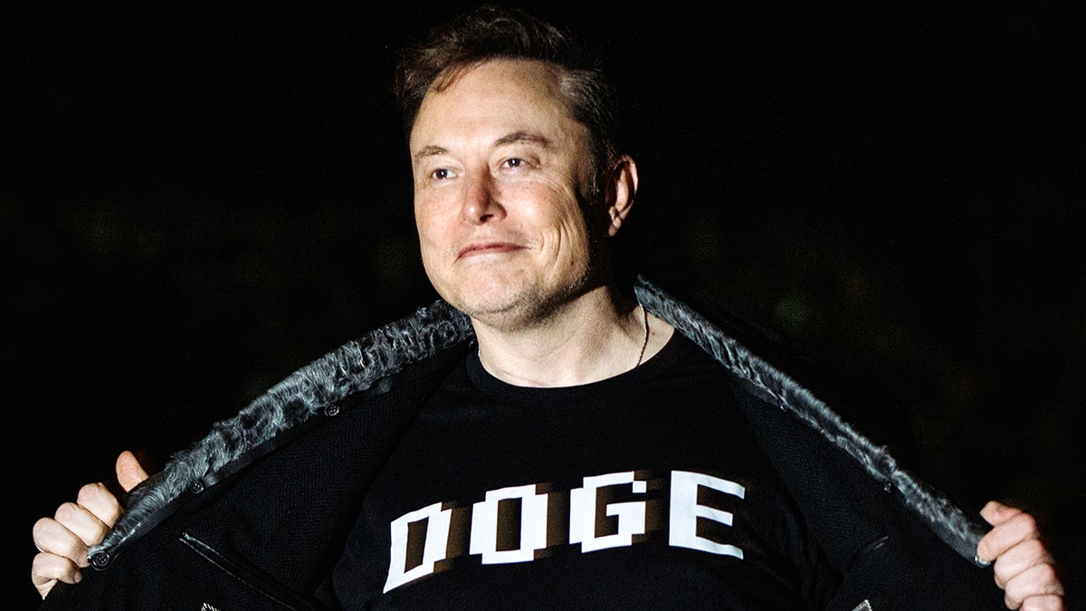 Elon Musk shows off black shirt with all caps white DOGE lettering