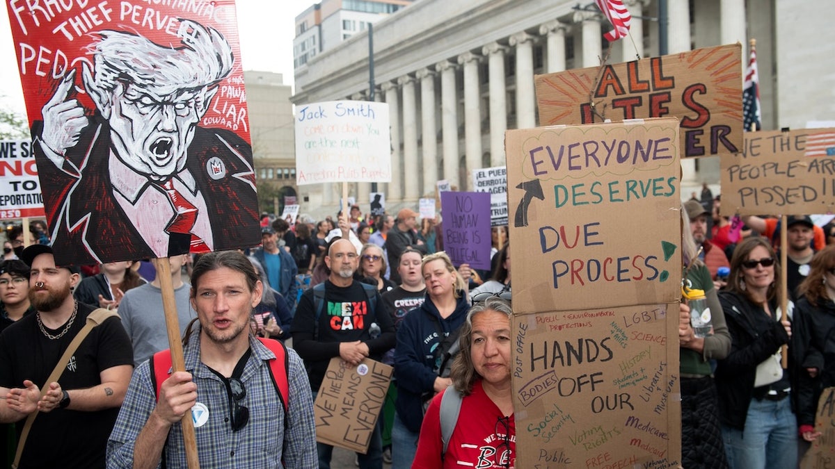 Demonstrators protest during a May Day demonstration against US President Donald Trump and his immigration policies in Denver, Colorado on May 1, 2025. (Photo by Jason Connolly / AFP)