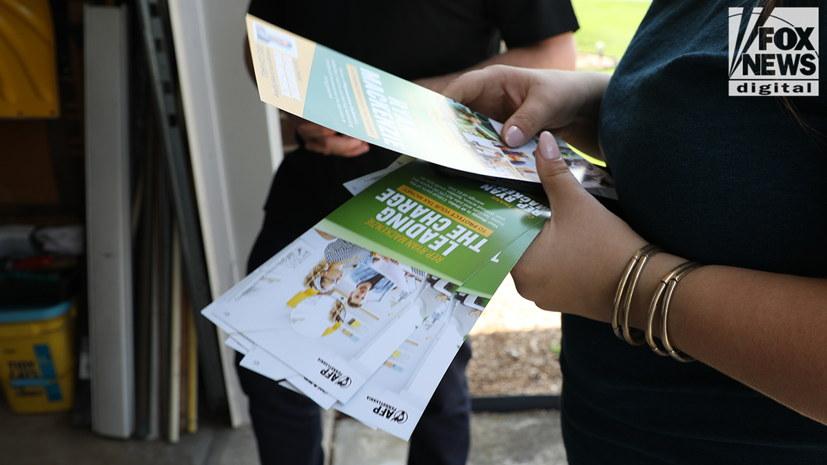 AFP passed out pamphlets to Mackenzie's constituents on Saturday about Trump's 2017 tax cuts. 