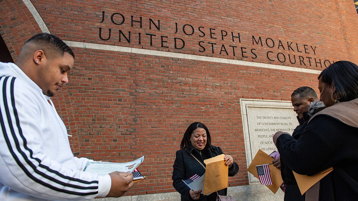 New US citizens organize citizenship paperwork