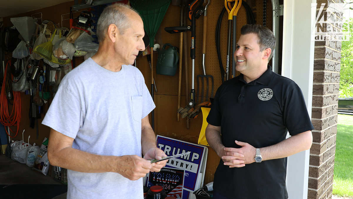 Mackenzie greets a supporter in his garage in Bethlehem, Pennsylvania. 
