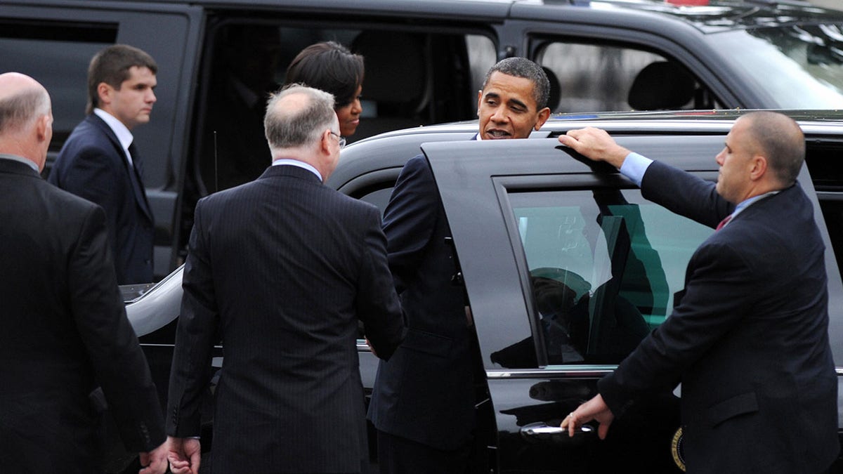 Then-President Barack Obama and Secret Service agents
