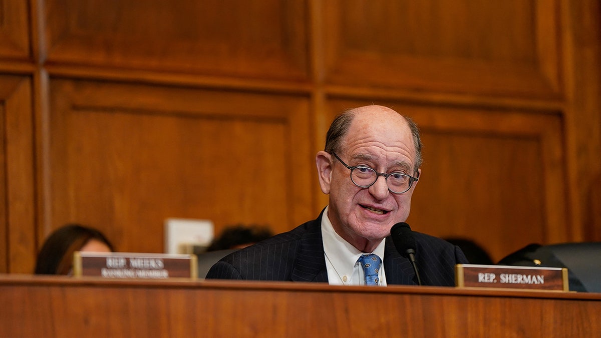 Rep. Brad Sherman looks down from seat during hearing