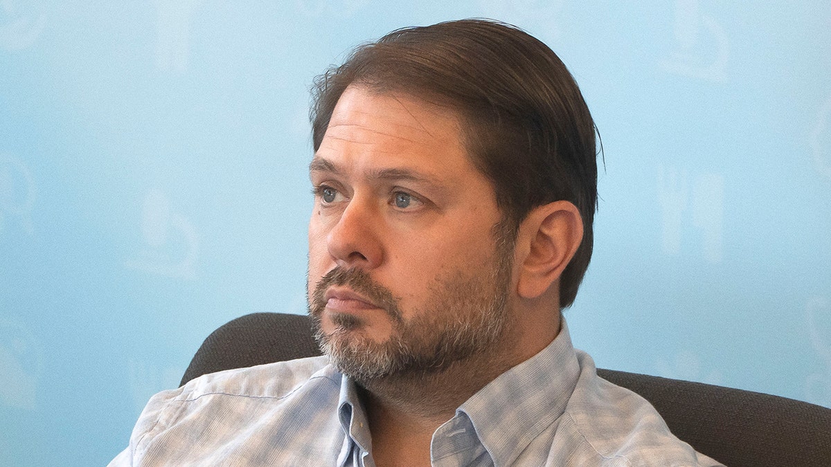 Sen. Ruben Gallego listening during an event