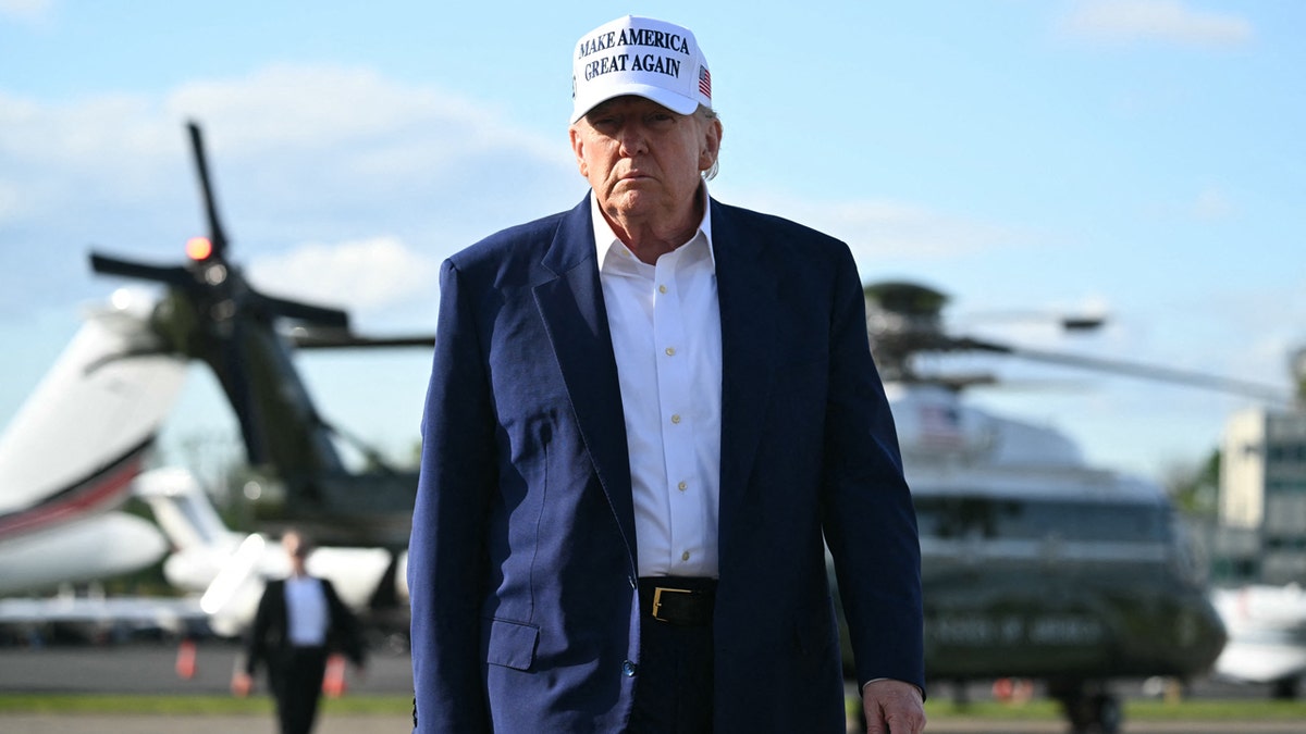 Trump walking over to speak to the press