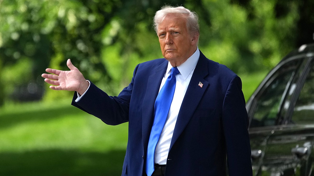 President Donald Trump waves