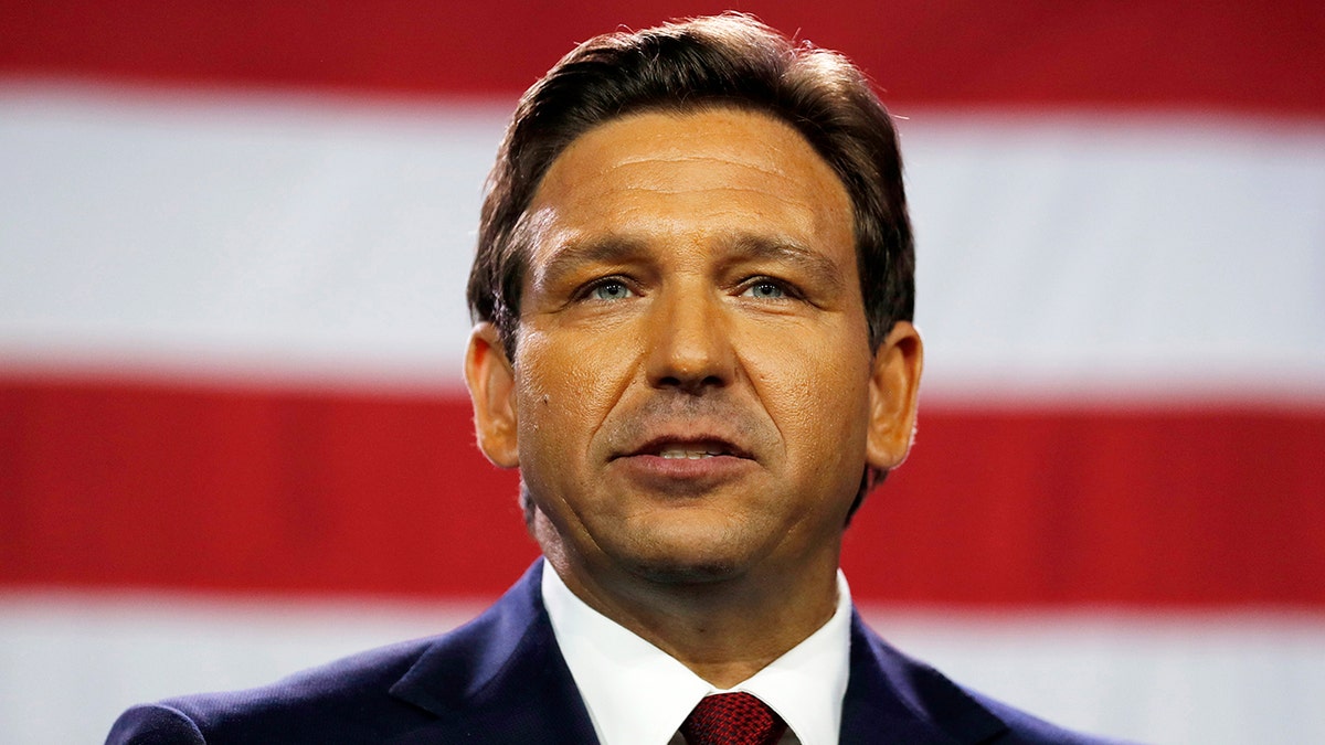 Ron DeSantis closeup shot, US flag background