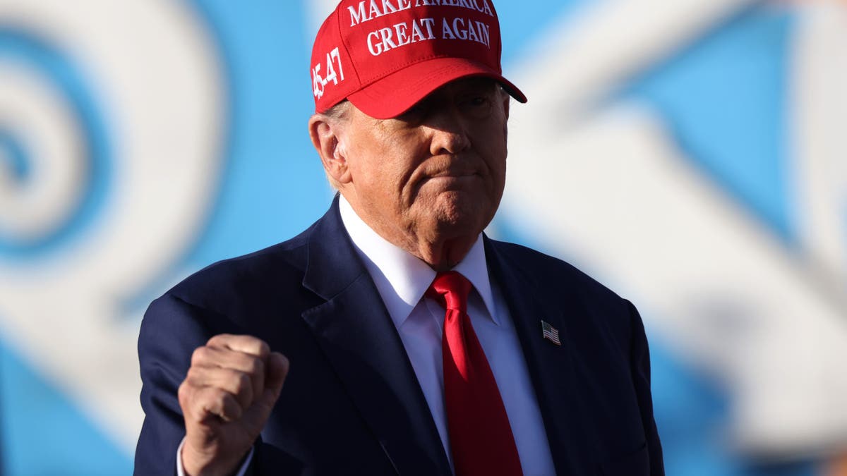 Trump in red hat at NJ rally