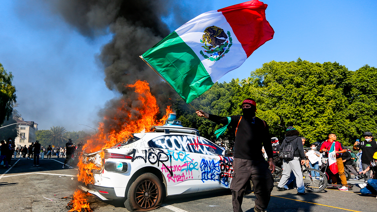 Protester waving Mexican flag
