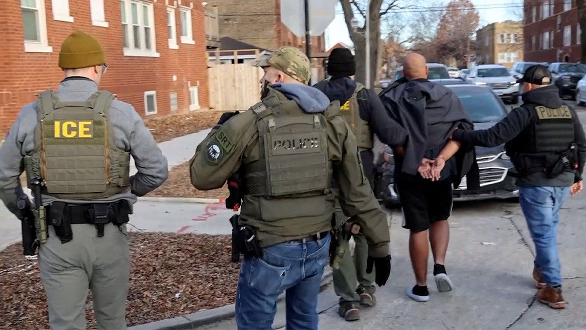 U.S. Immigration and Customs Enforcement agents conduct an arrest as part of President Donald Trump's wide-ranging immigration crackdown in Chicago on Jan. 26, 2025.