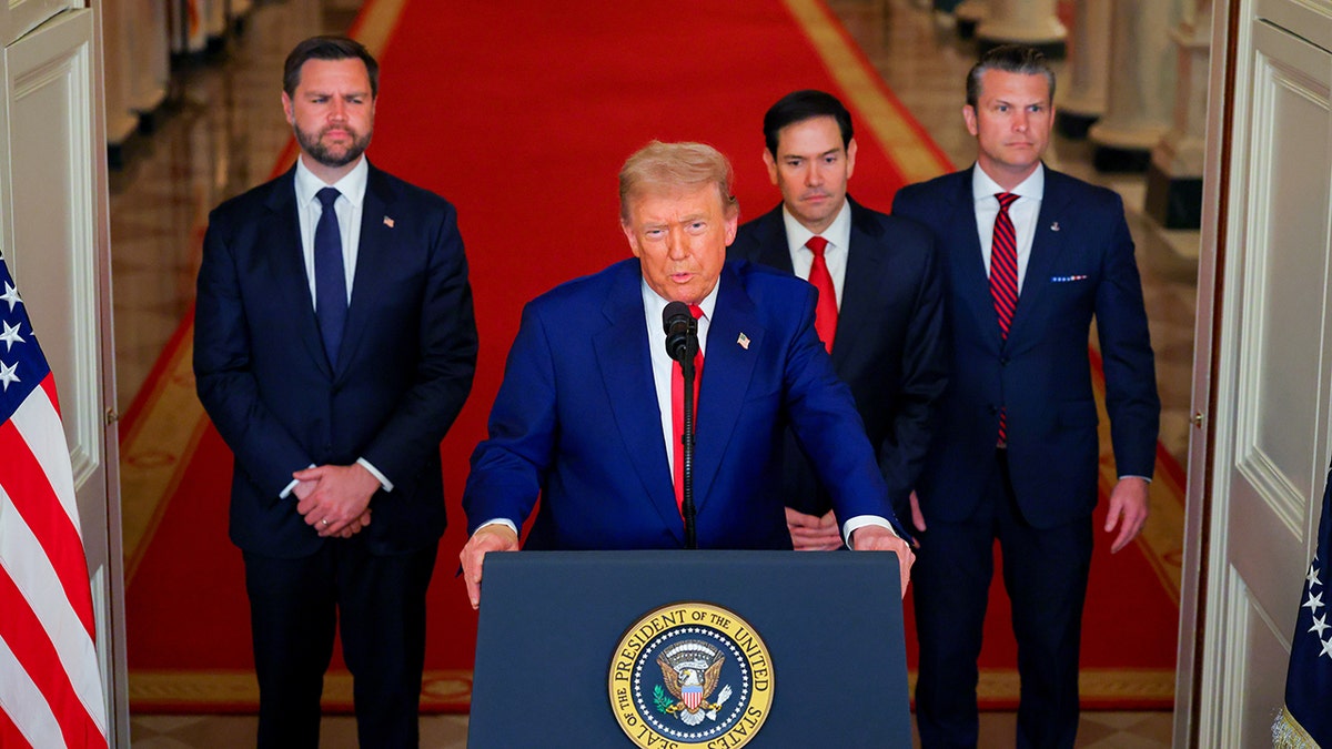 Trump at lectern, with VP Vance, Secs. Rubio, Hegseth behind him