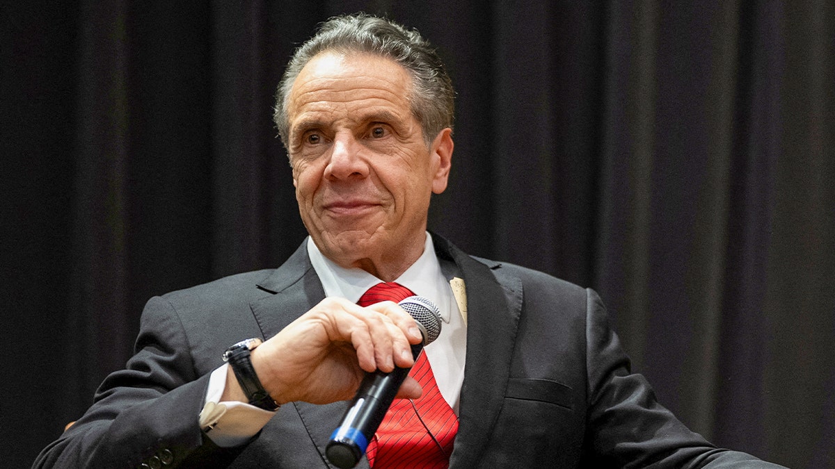 Andrew Cuomo closeup shot holding wireless mic