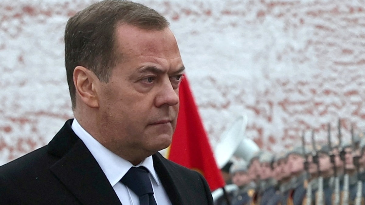 Russian Deputy Chairman of the Security Council Dmitry Medvedev takes part in a wreath-laying ceremony marking Defender of the Fatherland Day at the Tomb of the Unknown Soldier by the Kremlin Wall in Moscow on Feb. 23, 2024.