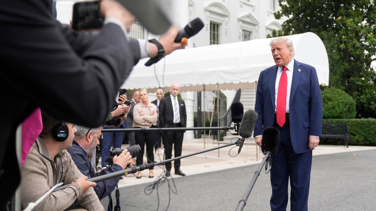 President Donald Trump, from right, speaks with reporters as White House Deputy Chief of Staff Stephen Miller and White House press secretary Karoline Leavitt listen before departing the White House on his way to attend the G7 Summit in Canada, Sunday, June 15, 2025, in Washington.