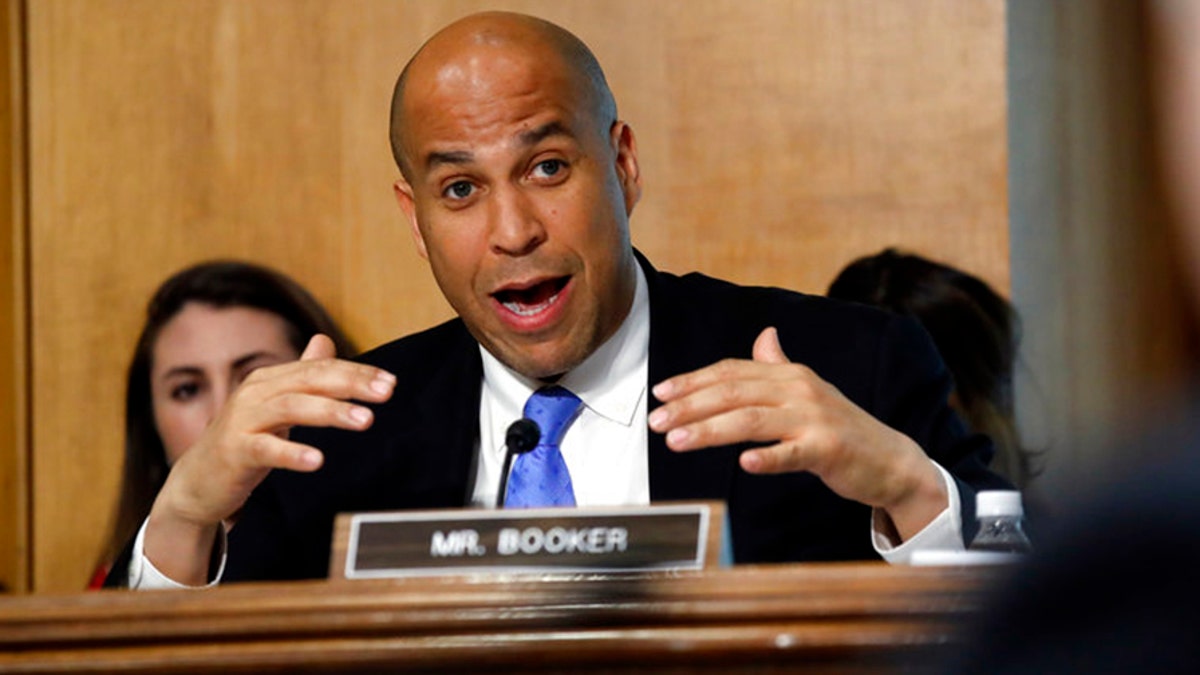 Sen. Cory Booker, D-N.J., questions Secretary of State-designate Mike Pompeo during the Senate Foreign Relations Committee confirmation hearing Thursday, April 12, 2018, on Capitol Hill in Washington. 