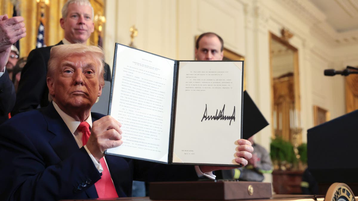 President Donald Trump reveals an executive order.