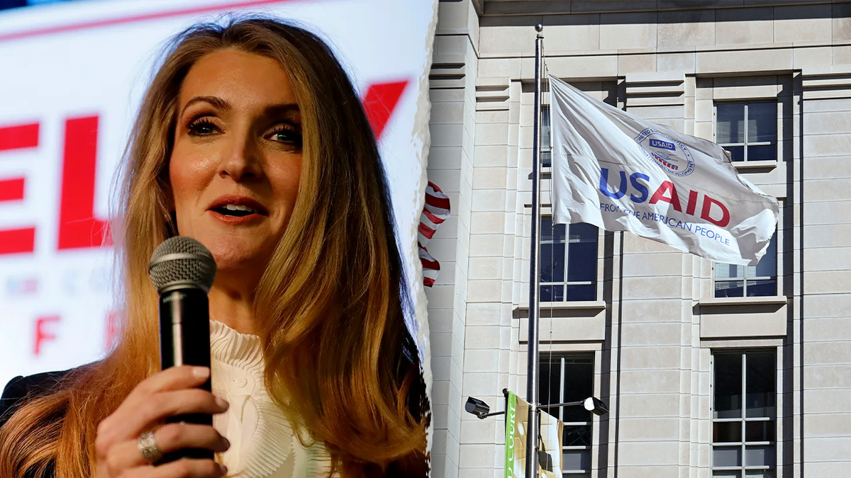 Loeffler with mic; USAID flag outside building
