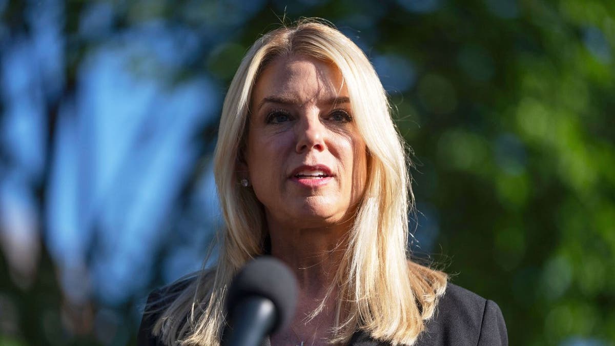 Attorney General Pam Bondi speaks to reporters outside the White House, Wednesday, May 7, 2025, in Washington. (AP Photo/Mark Schiefelbein)