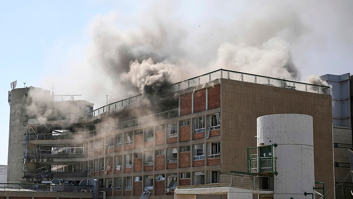 Smoke rises from a building of the Soroka hospital complex after it was hit by a missile fired from Iran in Be'er Sheva, Israel, Thursday, Jun. 19, 2025. 