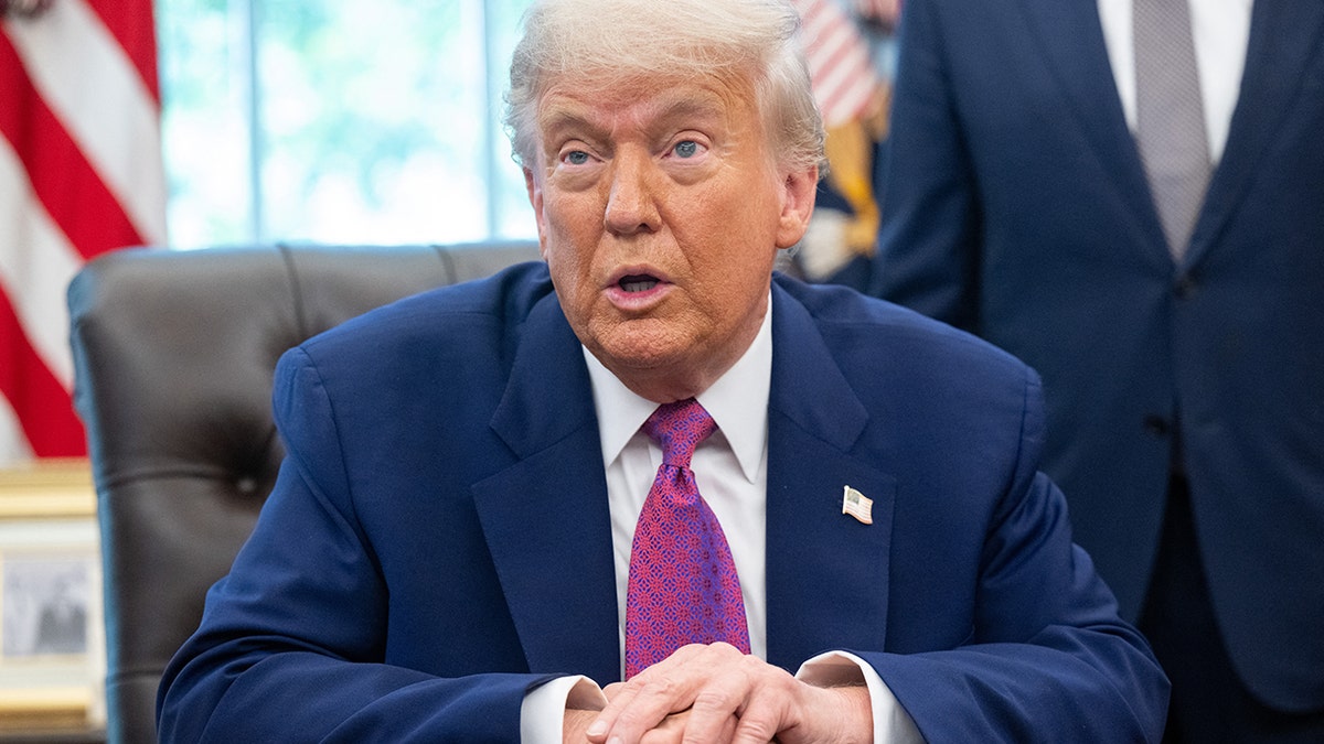 Trump in Oval Office at desk