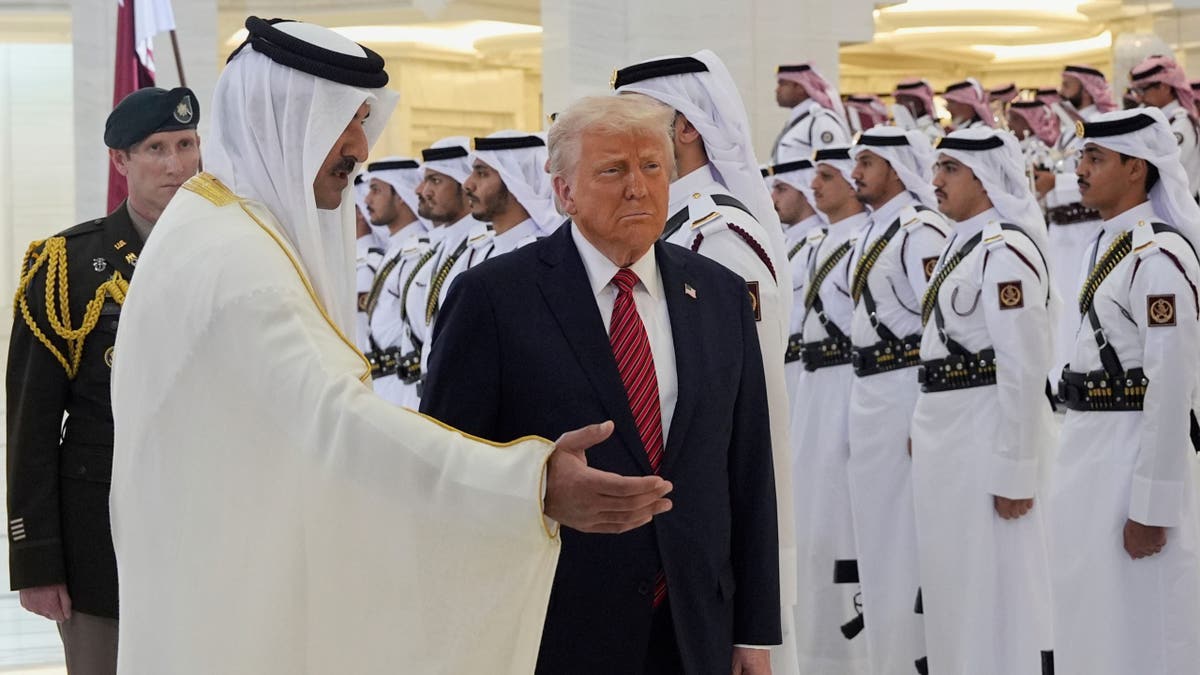 Qatar's Emir Sheikh Tamim bin Hamad Al Thani welcomes President Donald Trump during an official welcoming ceremony at the Amiri Diwan in Doha, Qatar, Wednesday, May 14, 2025. 