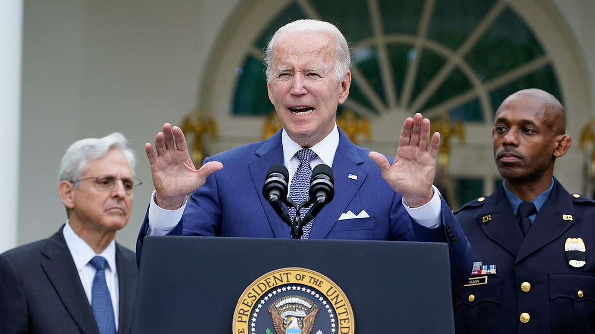 President Joe Biden speaks at podium