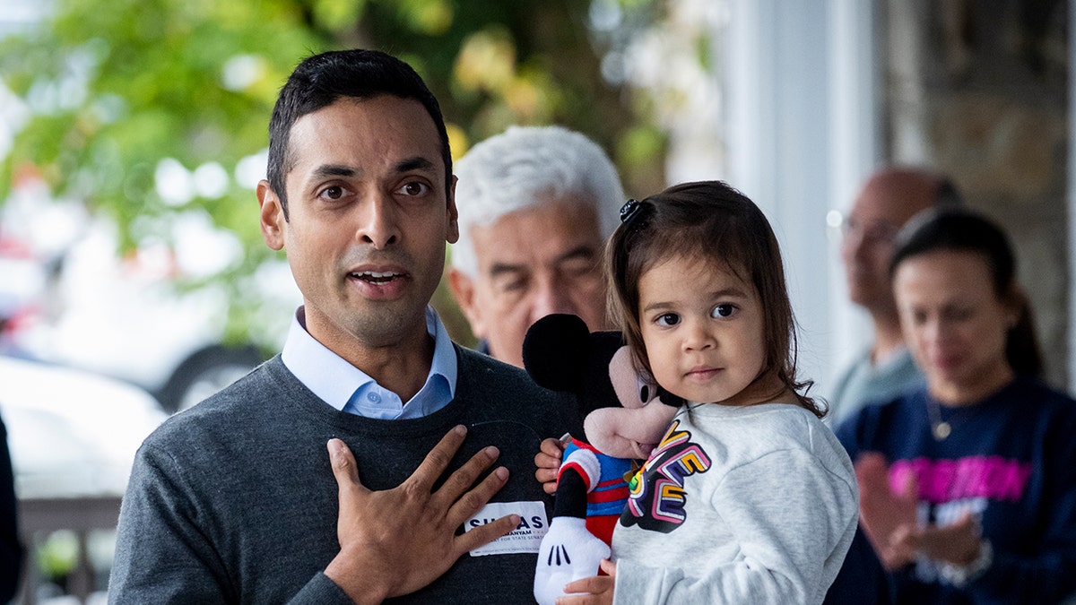 Virginia House Delegate Suhas Subramanyam holding child