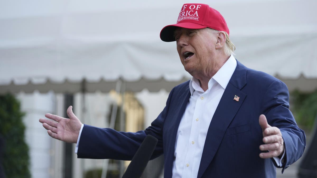 President Donald Trump speaks to the media before walking across the South Lawn of the White House, July 1, 2025. (AP Photo/Mark Schiefelbein)