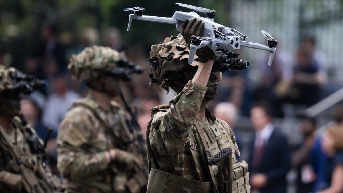 A soldier holds a drone in the U.S. Army's 250th anniversary parade on Constitution Avenue, NW, which is also President Donald Trump's 79th birthday on Saturday, June 14, 2025