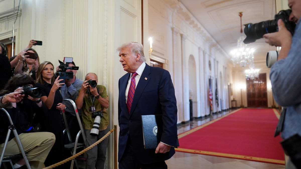 President Donald Trump arrives for a signing ceremony for the GENIUS Act in the East Room of the White House in Washington July 18, 2025. 