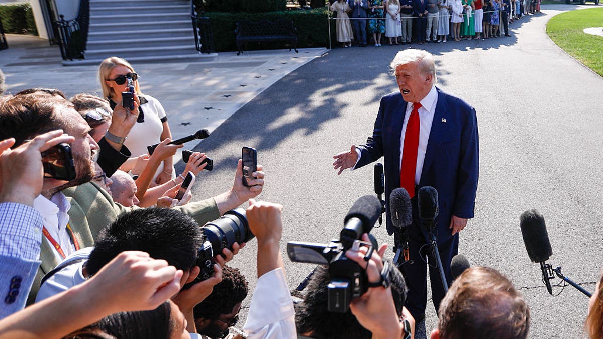 President Donald Trump speaks to members of the media before departing the White House en route to Turnberry, Scotland, on July 25, 2025 in Washington, D.C.