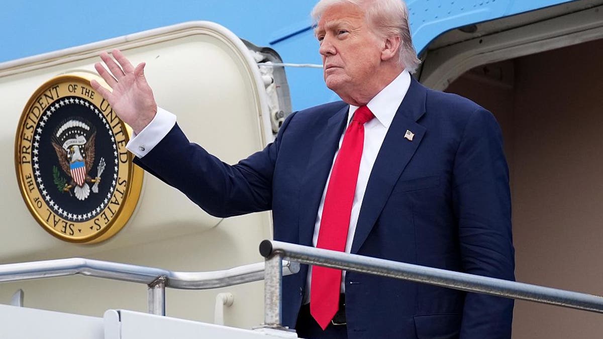 President Donald Trump waves as he arrives at Glasgow Prestwick Airport on July 25, 2025, in Prestwick, Scotland. 