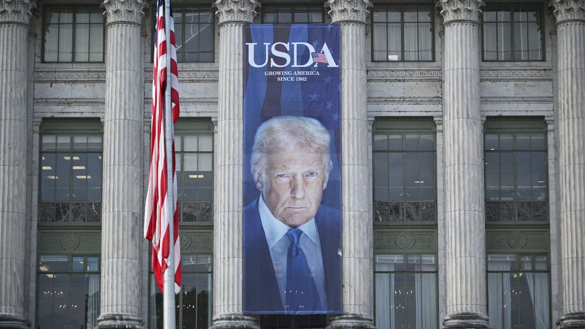USDA building with Trump photo on side