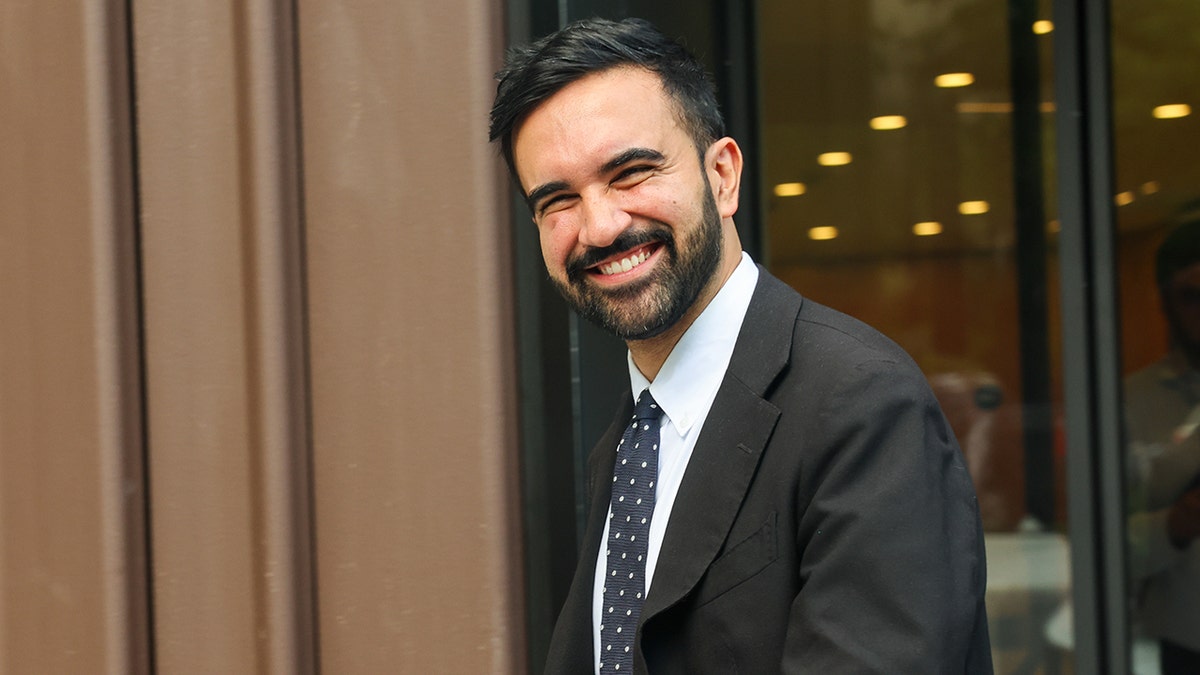 Mamdani smiling in NYC