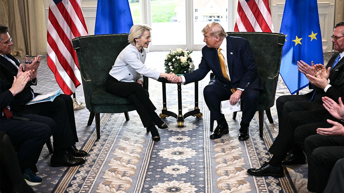 Donald Trump shakes hands with European Commission President Ursula von der Leyen after agreeing on a trade deal between the two economies following their meeting, in Turnberry south west Scotland on July 27, 2025