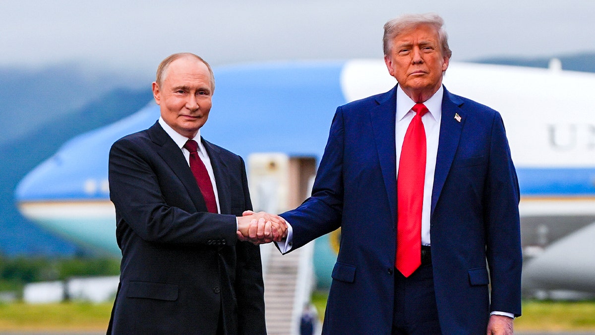 President Donald Trump greets Russia's President Vladimir Putin, Friday, Aug. 15, 2025, at Joint Base Elmendorf-Richardson, Alaska.