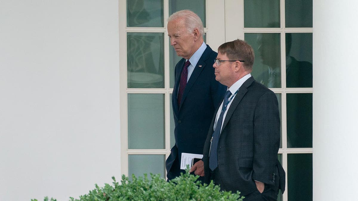 Biden walking with his doctor at White House