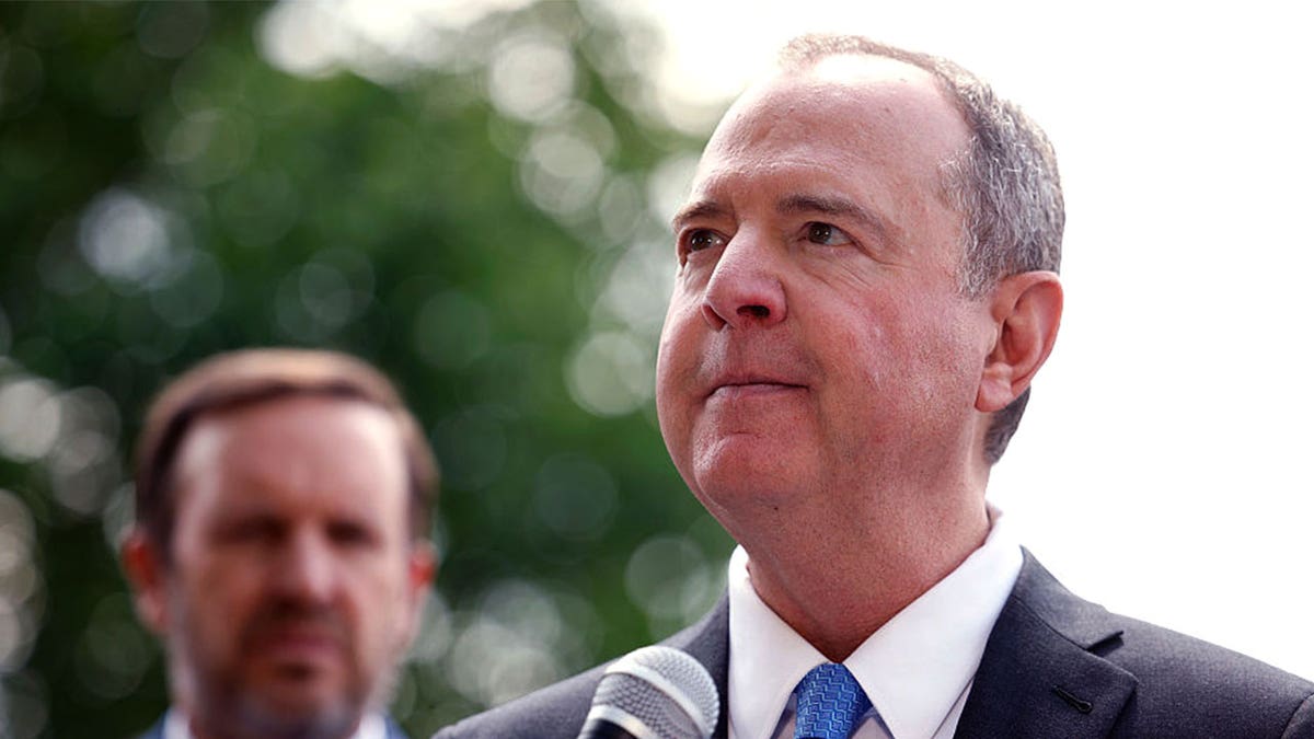 Sen. Adam Schiff looks on