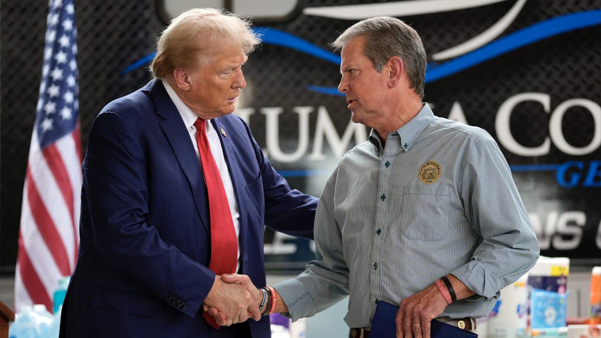 President Donald Trump shakes hands with Brian Kemp