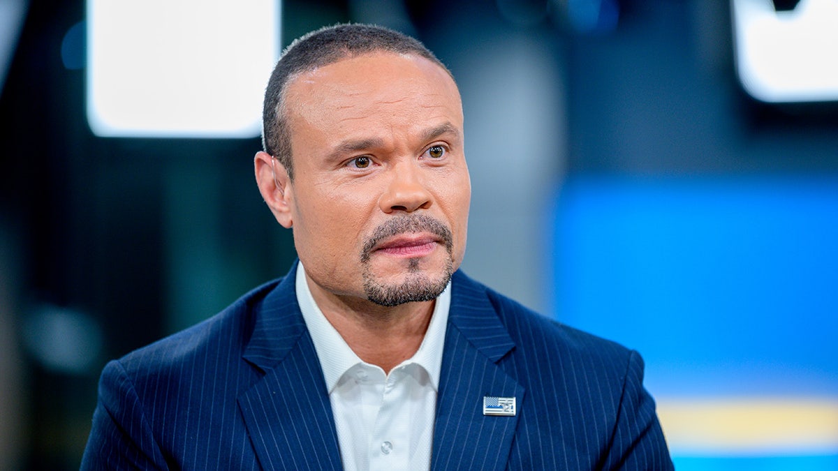 Dan Bongino wearing a suit