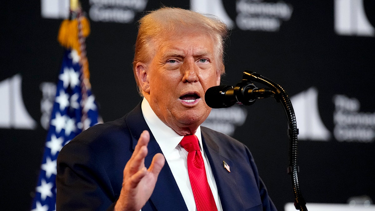 Donald Trump speaking at a podium.