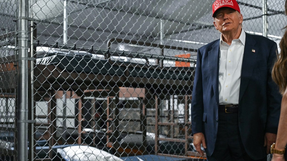 US President President Donald Trump tours a migrant detention center, dubbed "Alligator Alcatraz," located at the site of the Dade-Collier Training and Transition Airport in Ochopee, Florida on July 1, 2025. (ANDREW CABALLERO-REYNOLDS / AFP)