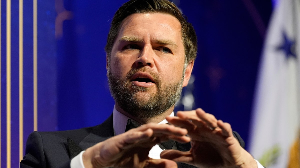 Vance gestures with hands during DC gala