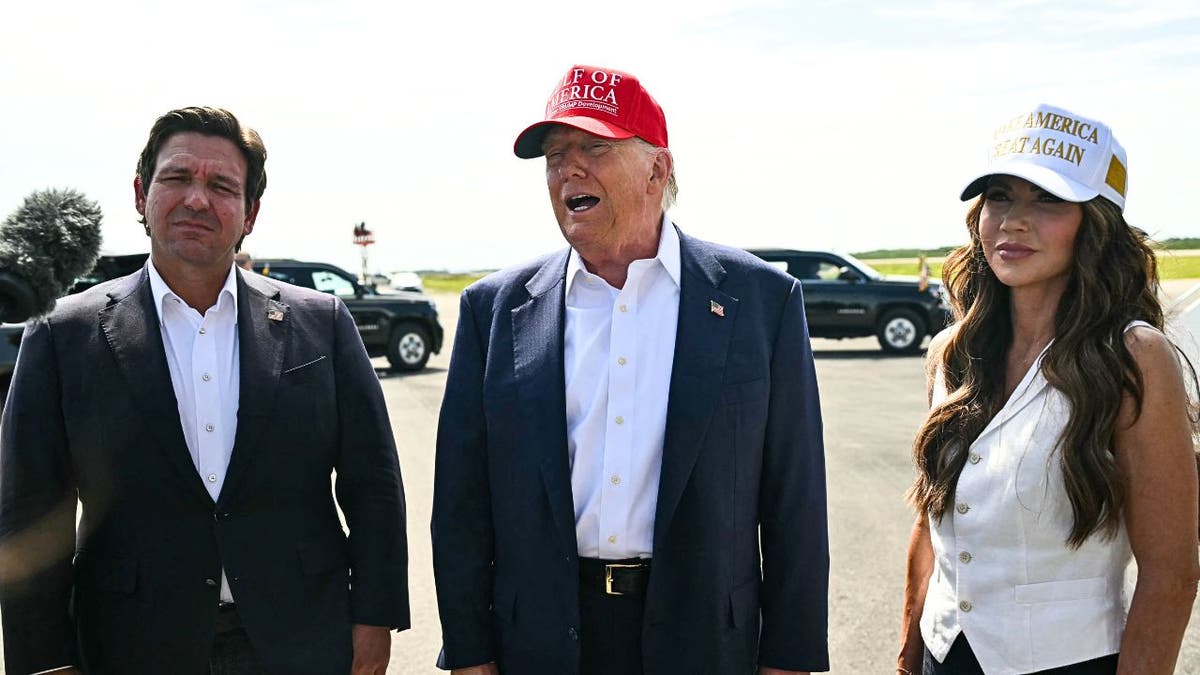 President Donald Trump alongside Secretary of Homeland Security Kristi Noem and Florida Governor Ron DeSantis