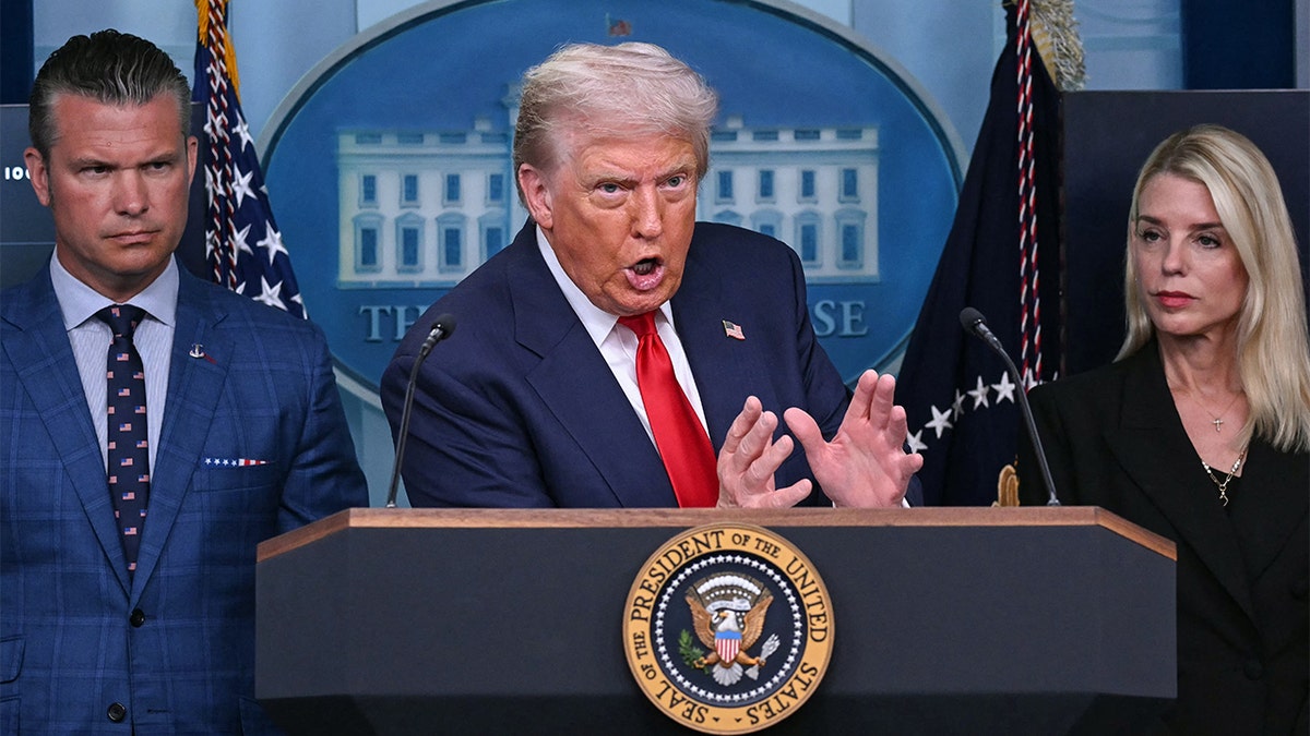 Defense Secretary Pete Hegseth, left, President Donald Trump, center, Attorney General Pam Bondi, right.