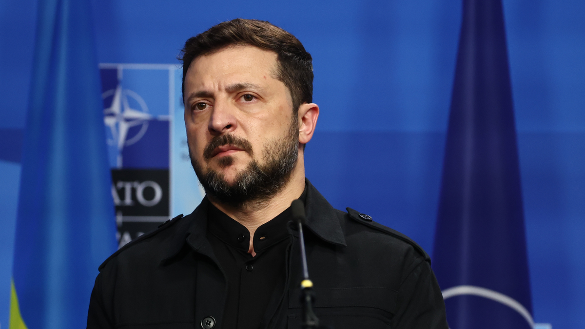 Ukrainian President Volodymyr Zelenskyy listens to a question at The Hague