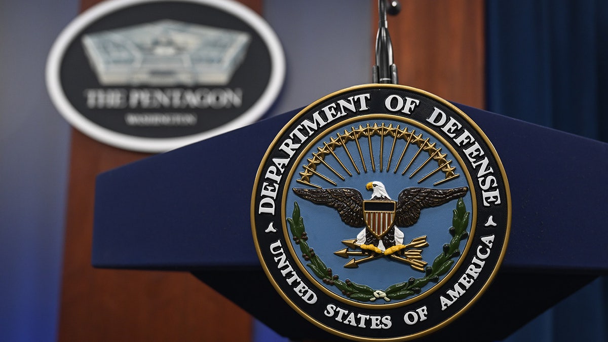 Department of Defense logo on podium